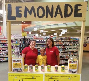 Emily Goodroad (left) and Jenn Wilson of CommunityAmerica Credit Union,  pitching in to help with the Alex’s Lemonade Stand fund-raising in Liberty.